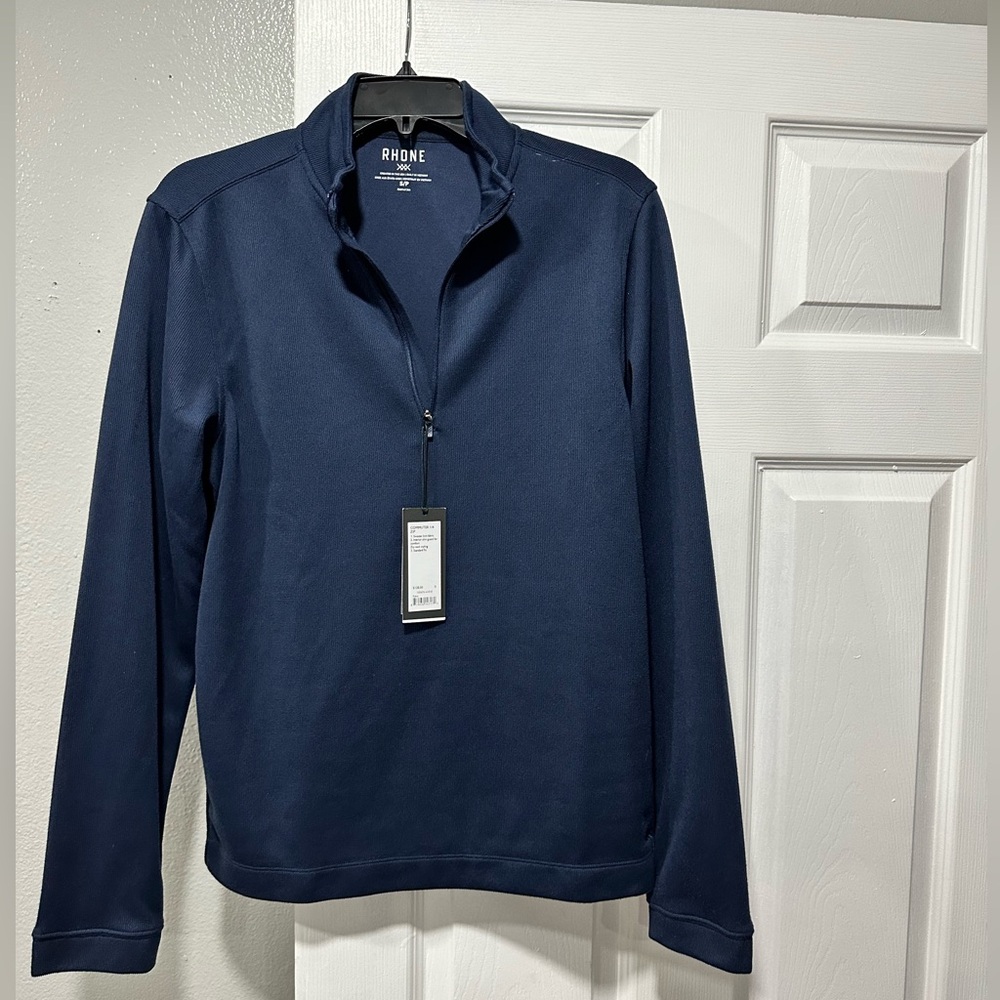 Rhone perfect mid-layer for the office or date night. Navy sweater knit fabric.